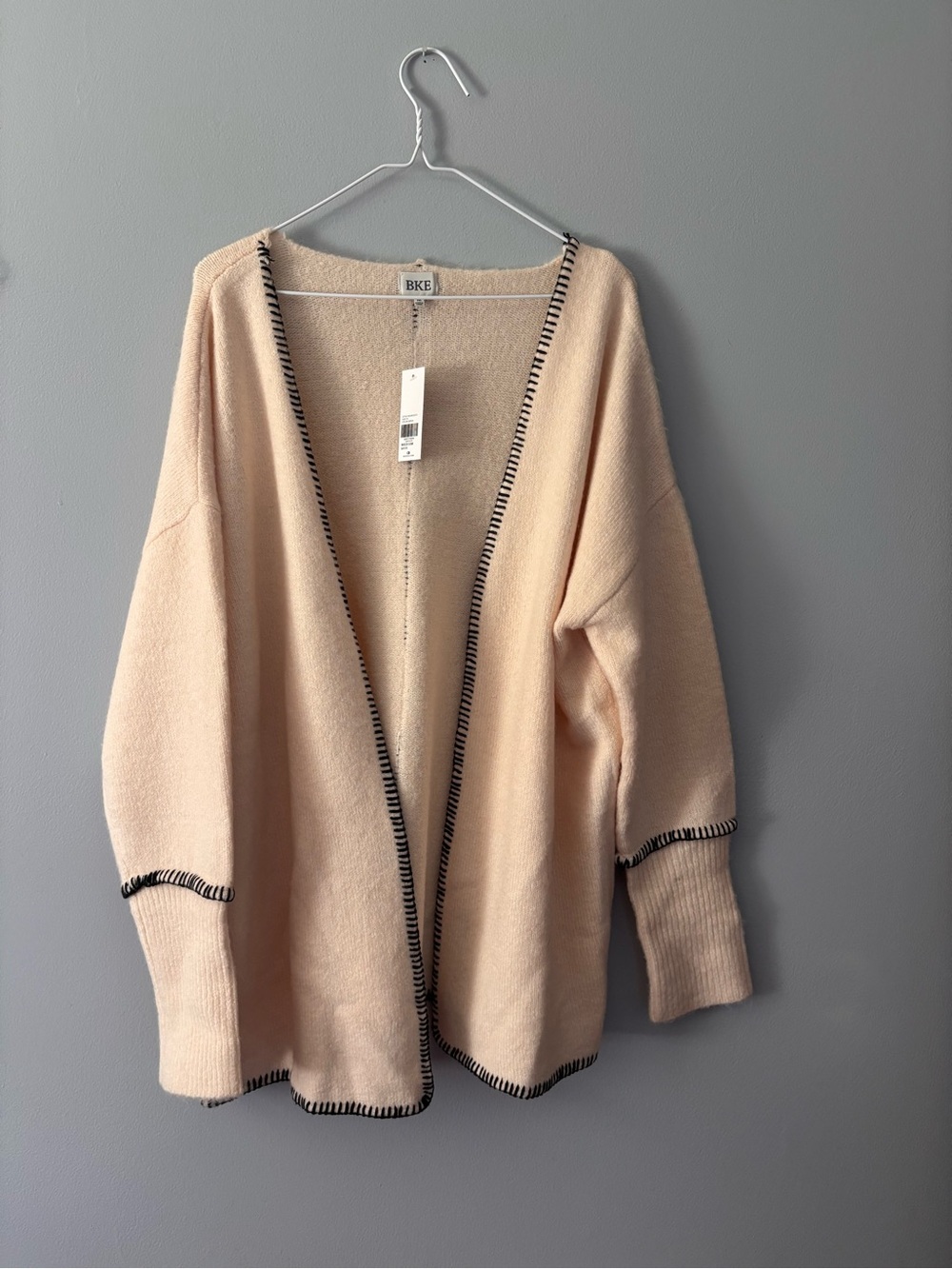 NWT BKE Cardigan Sweater. Medium. Cream with black trim.